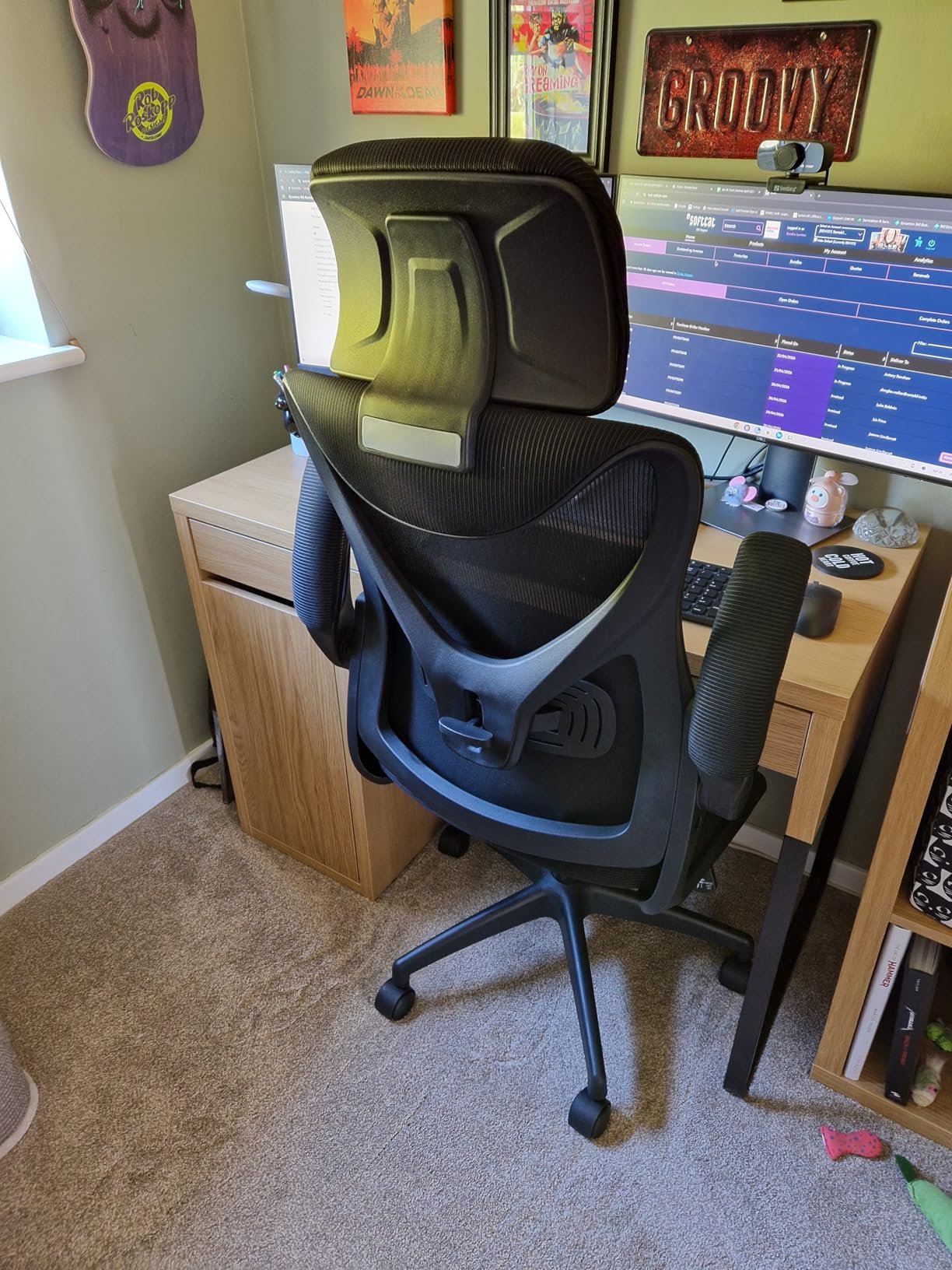 Customer rear-view photo of the chair at a computer desk